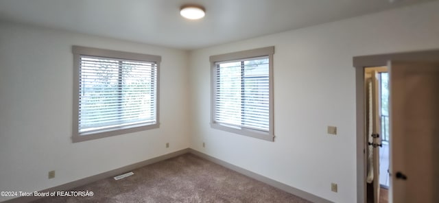 view of carpeted spare room