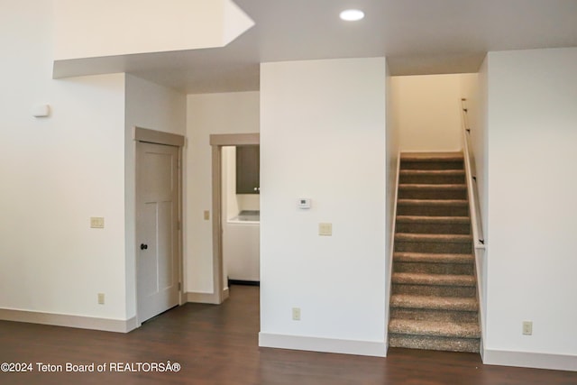 stairs with dark hardwood / wood-style flooring