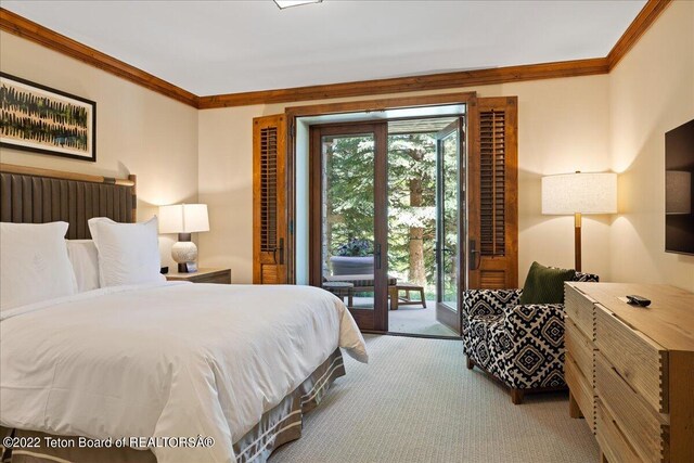 bedroom featuring access to outside, crown molding, and carpet flooring