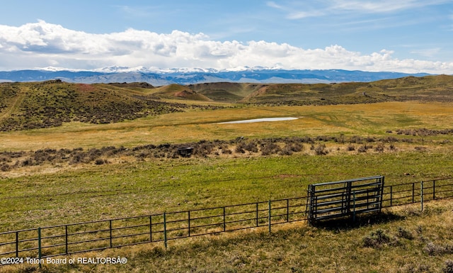 view of mountain feature with a rural view