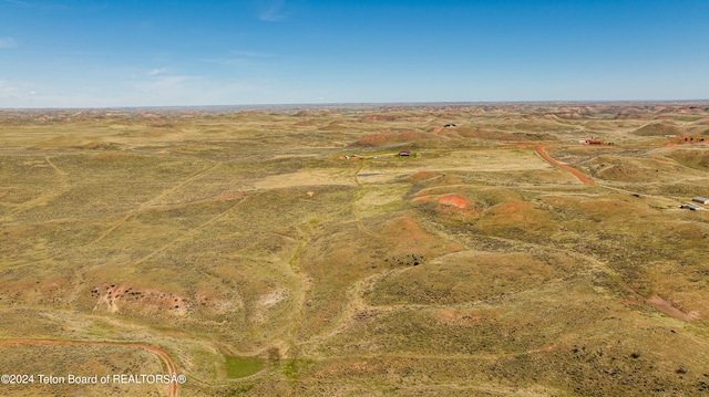 birds eye view of property featuring a rural view