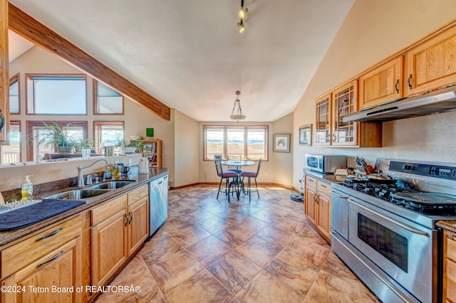 kitchen with stainless steel appliances, pendant lighting, high vaulted ceiling, sink, and light tile floors