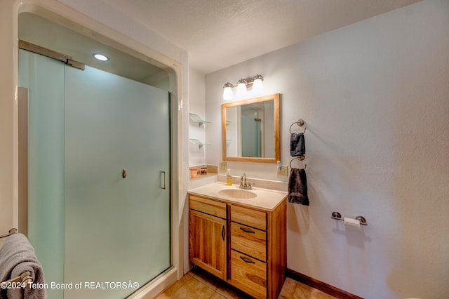 bathroom featuring tile flooring and vanity with extensive cabinet space