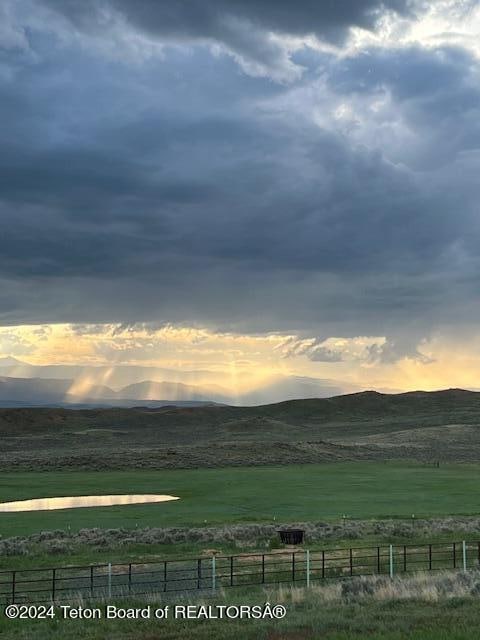 property view of mountains featuring a rural view