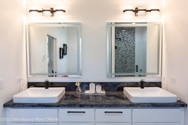 bathroom with vanity and an enclosed shower