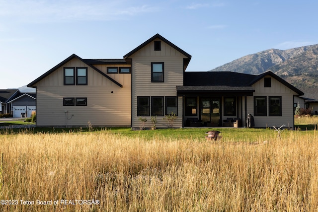 back of property featuring a mountain view