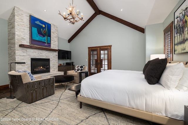 bedroom featuring high vaulted ceiling, french doors, an inviting chandelier, a stone fireplace, and beam ceiling