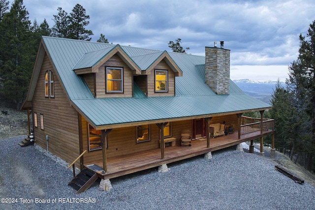 view of front of house featuring a mountain view and a porch