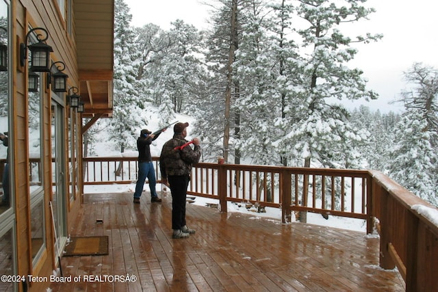 view of snow covered deck