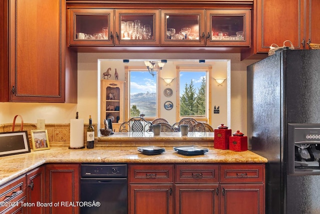 kitchen with black fridge and light stone counters