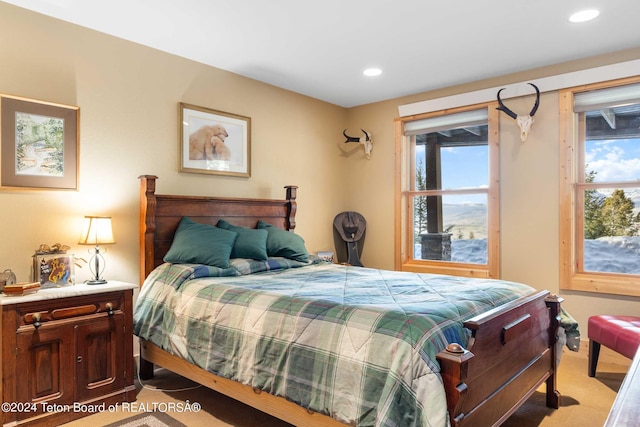 bedroom featuring light carpet