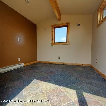 spare room featuring vaulted ceiling with beams and a baseboard radiator