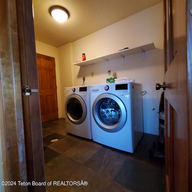 washroom with independent washer and dryer