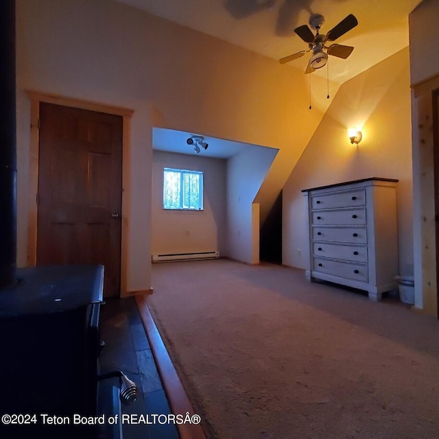 bonus room featuring carpet flooring, baseboard heating, lofted ceiling, and ceiling fan