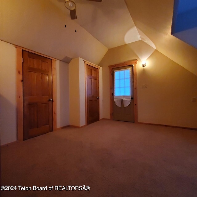 bonus room with carpet, ceiling fan, and lofted ceiling