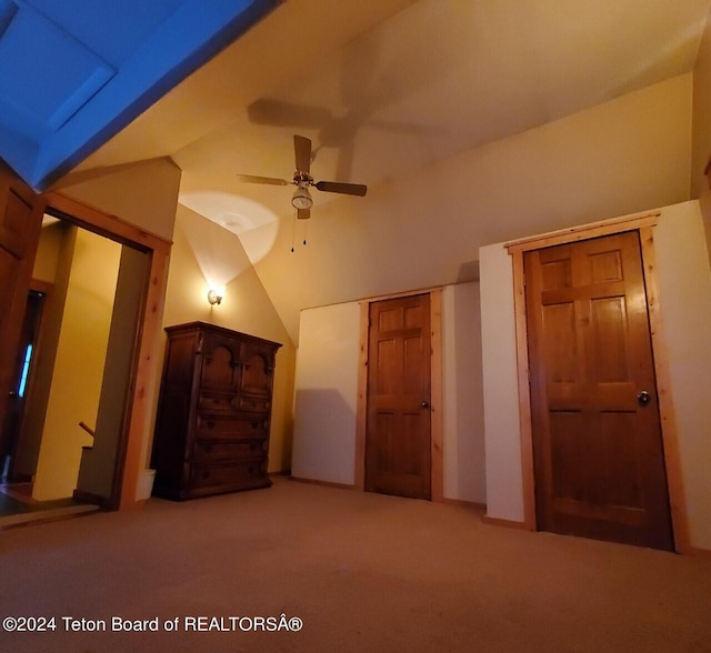 bonus room featuring ceiling fan, carpet floors, and lofted ceiling