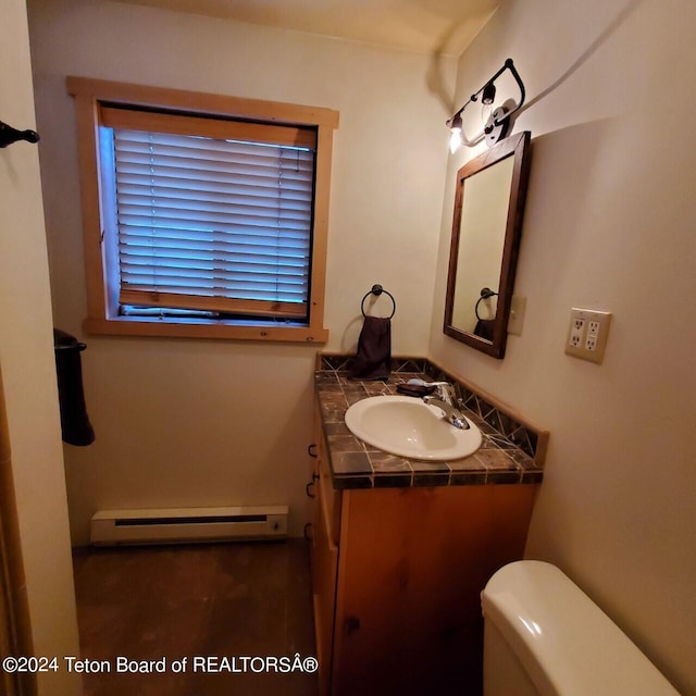 bathroom featuring vanity, a baseboard radiator, and toilet