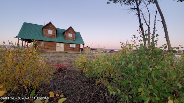 view of property exterior at dusk