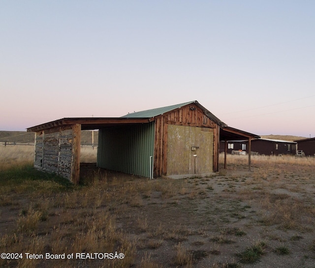 view of outdoor structure at dusk