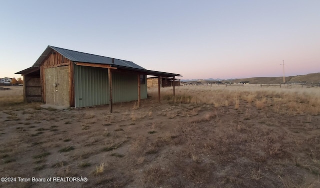 view of outdoor structure at dusk