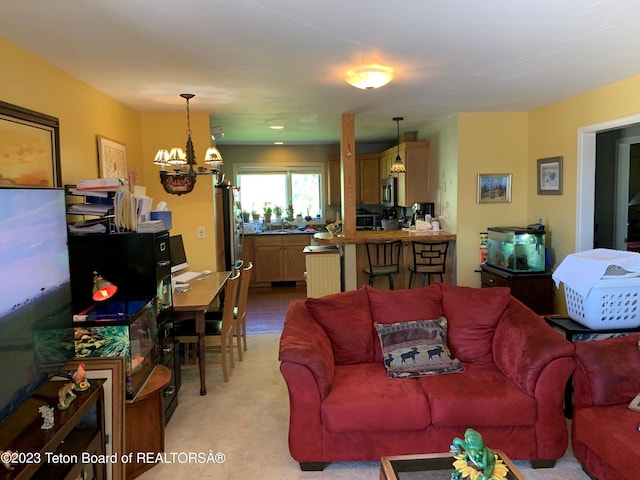 955 Budge Dr Unit 4, Jackson, WY 83001 - living room featuring a chandelier and light carpet