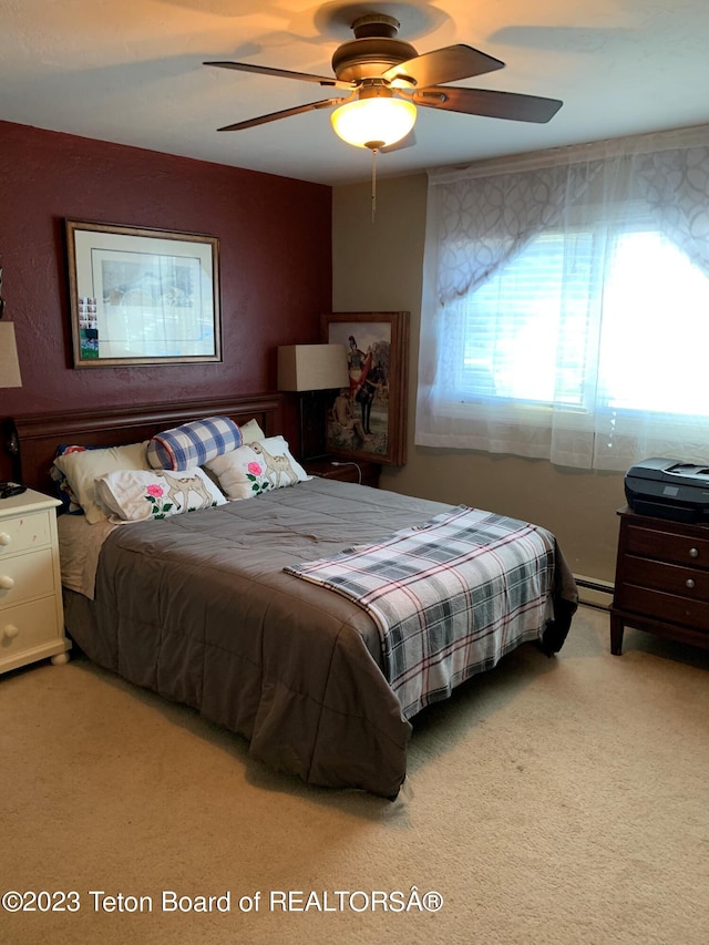955 Budge Dr Unit 4, Jackson, WY 83001 - bedroom with a baseboard radiator, carpet, and ceiling fan