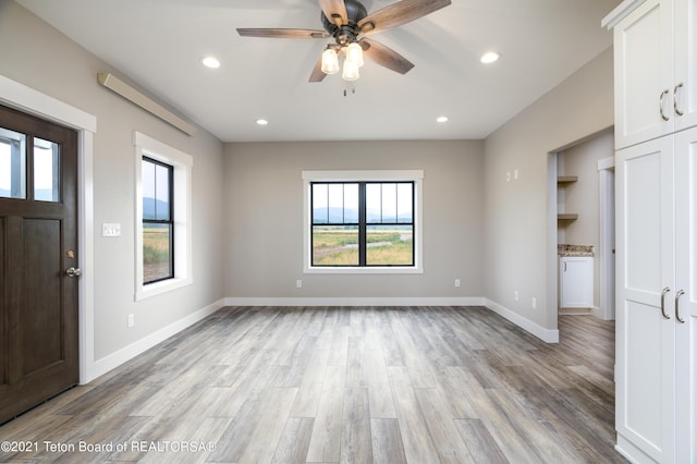 1845 S 5000 W, Driggs, ID 83422 - interior space featuring a wealth of natural light, light wood-style floors, ceiling fan, and baseboards