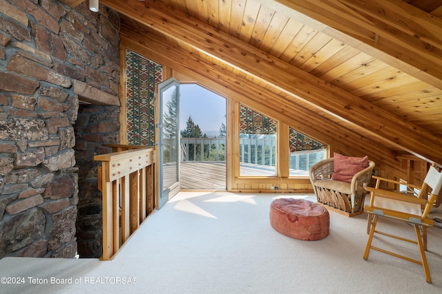 carpeted living room featuring vaulted ceiling with beams and wood ceiling