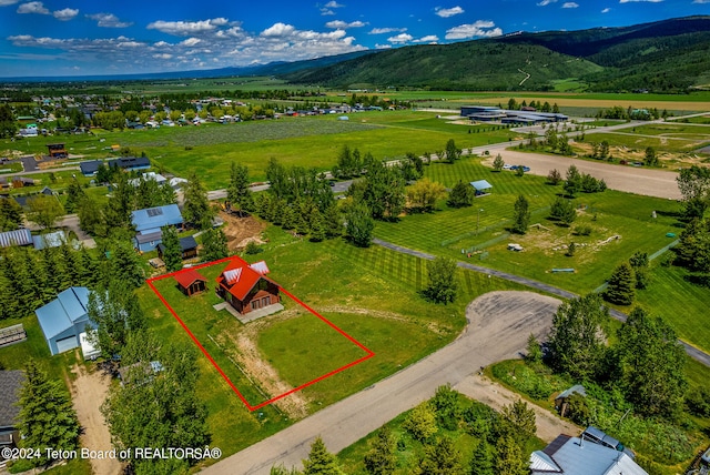 drone / aerial view featuring a mountain view