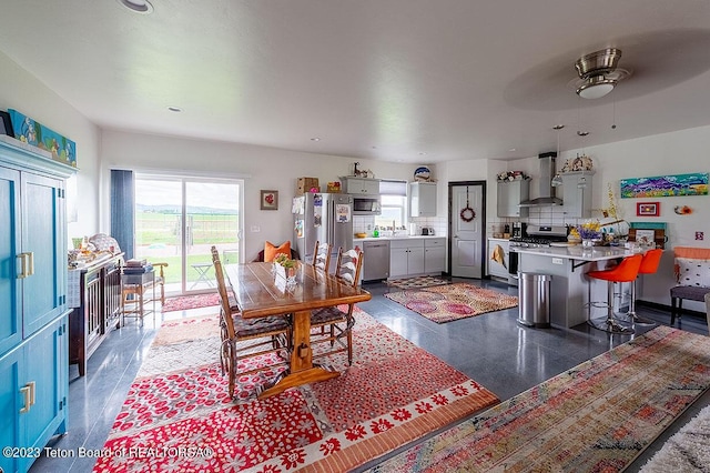 dining space featuring ceiling fan