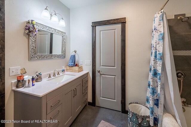 bathroom featuring vanity and walk in shower