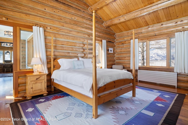 bedroom featuring wood ceiling, dark hardwood / wood-style floors, rustic walls, and lofted ceiling with beams