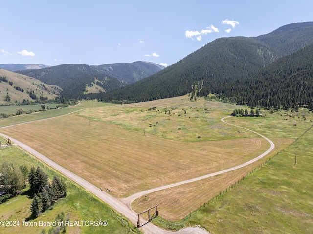 mountain view featuring a rural view