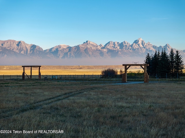 property view of mountains featuring a rural view