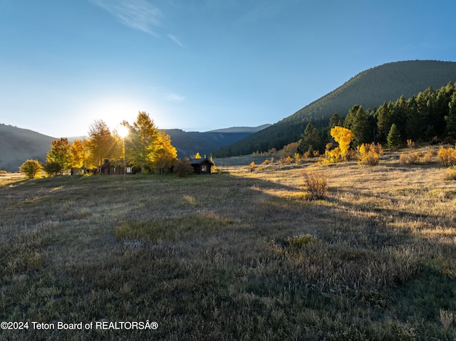 mountain view featuring a rural view