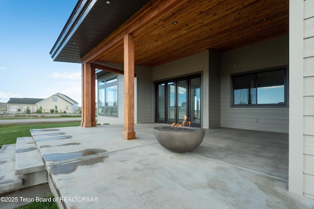 view of patio / terrace featuring an outdoor fire pit