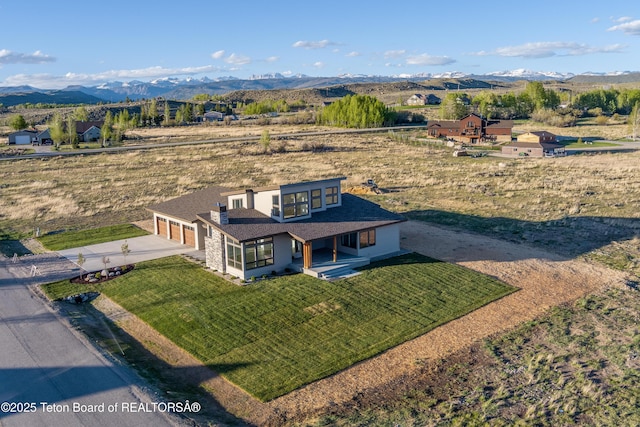 bird's eye view with a mountain view