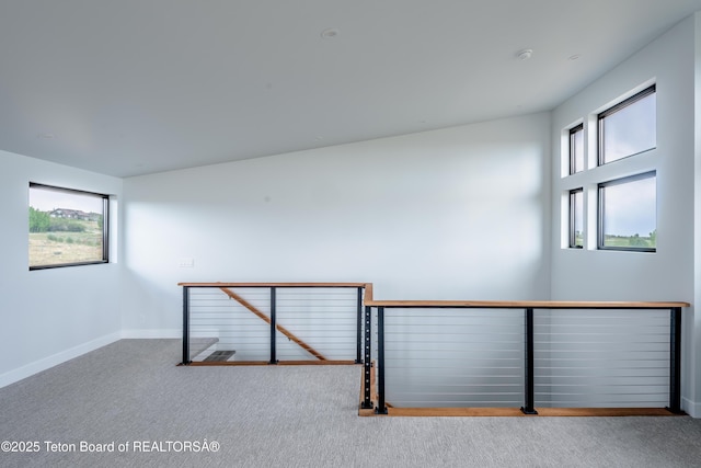 empty room with light colored carpet