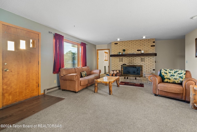 carpeted living room with a baseboard radiator and a fireplace