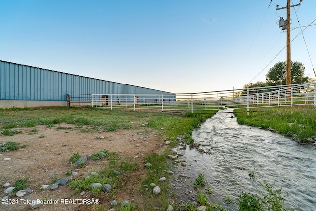 view of yard with a rural view