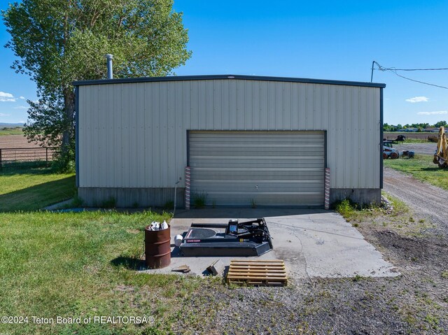 garage featuring a yard