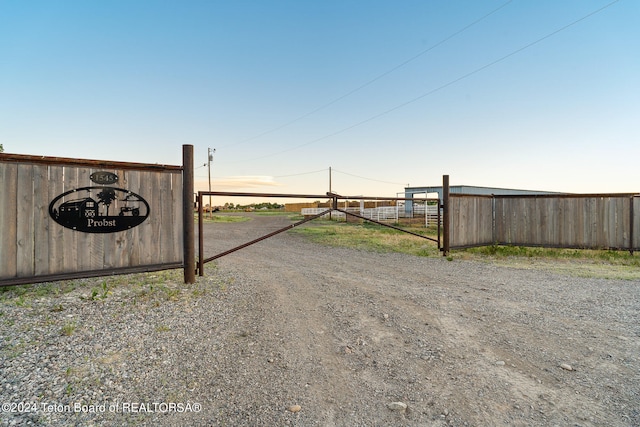 view of gate at dusk