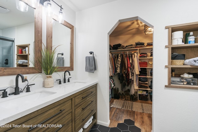 bathroom featuring vanity and wood-type flooring