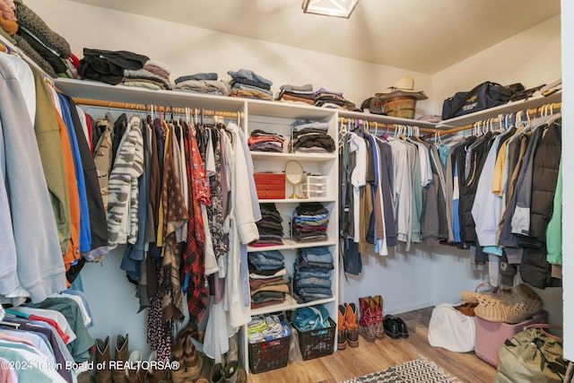 spacious closet featuring hardwood / wood-style floors