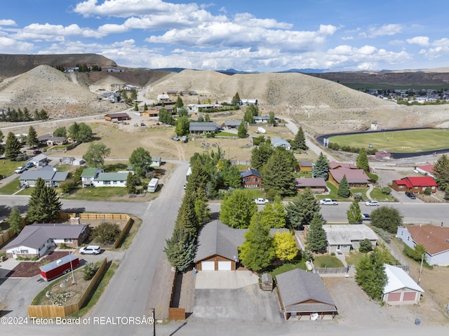 birds eye view of property with a mountain view