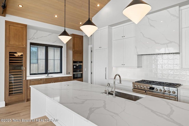 kitchen with wooden ceiling, double oven range, a sink, and decorative backsplash