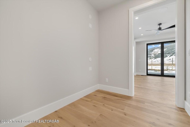 unfurnished room featuring ceiling fan, recessed lighting, light wood-type flooring, and baseboards