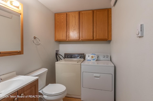 laundry room featuring washing machine and dryer and sink