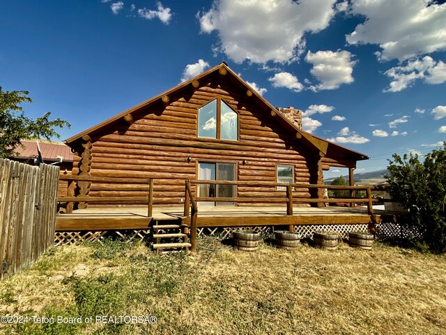 1404 Warm Springs Dr, Dubois, WY 82513 - back of property with log exterior and a deck