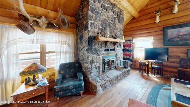 1404 Warm Springs Dr, Dubois, WY 82513 - living room with wooden ceiling, hardwood / wood-style floors, log walls, and a fireplace